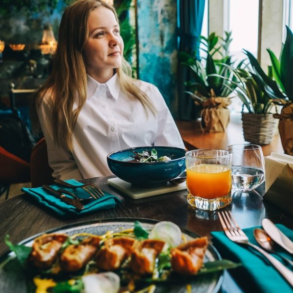 young-beautiful-woman-have-dinner-in-cafe-2023-11-27-04-49-08-utc
